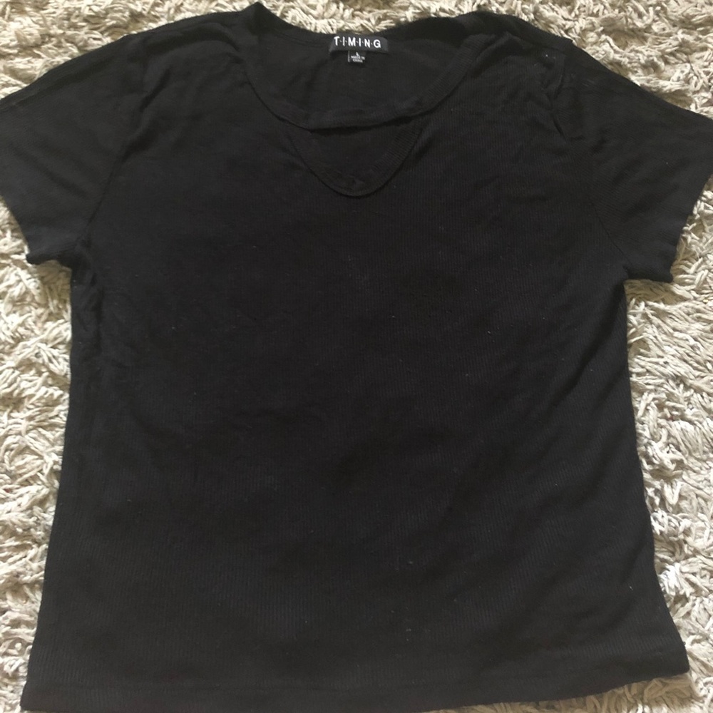 A black crop top with a cut neckline 🖤.